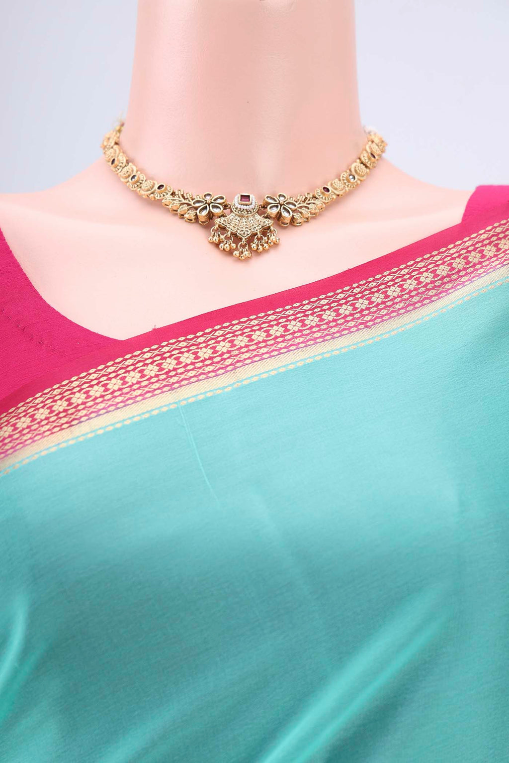 Border image of Mint Green Mysore Crepe Saree with Plain Body and Zari Border. 