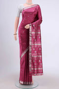 Pink Assam Silk Saree with Zari Butta on the body and Zari Border.  displayed on a mannequin