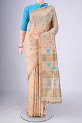 Beige Assam Silk Saree with Thread Butta on the body and Thread Border.  displayed on a mannequin