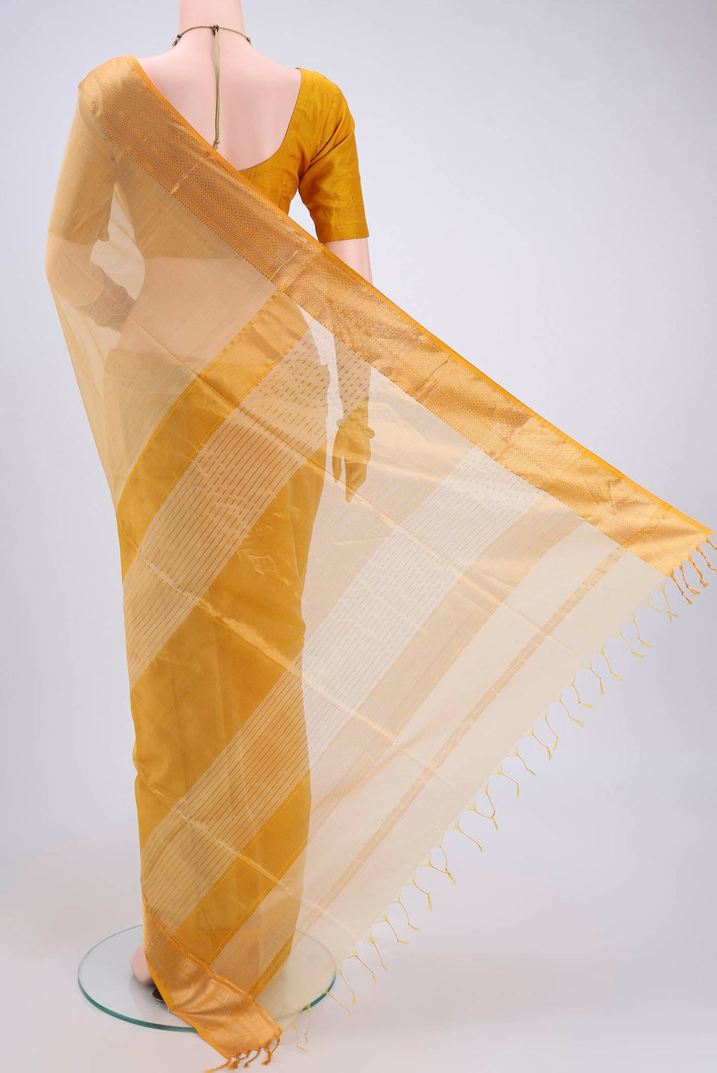 Flat view of Cream Dual Tone Maheshwari Silk Cotton Saree with Plain Body and Zari Border. 
