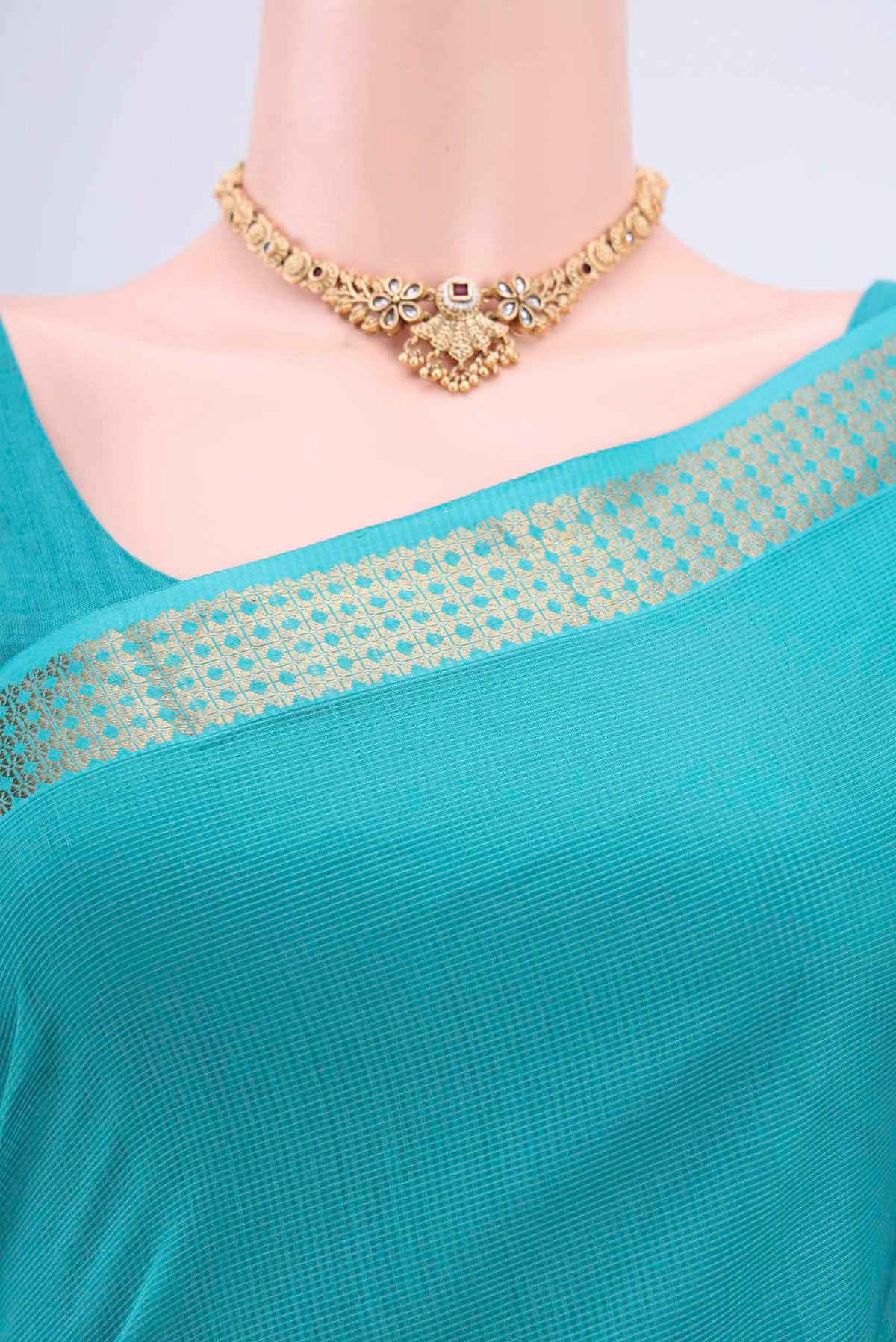 Border image of Turquoise Maheshwari Silk Cotton Saree with Plain Body and Zari Border. 