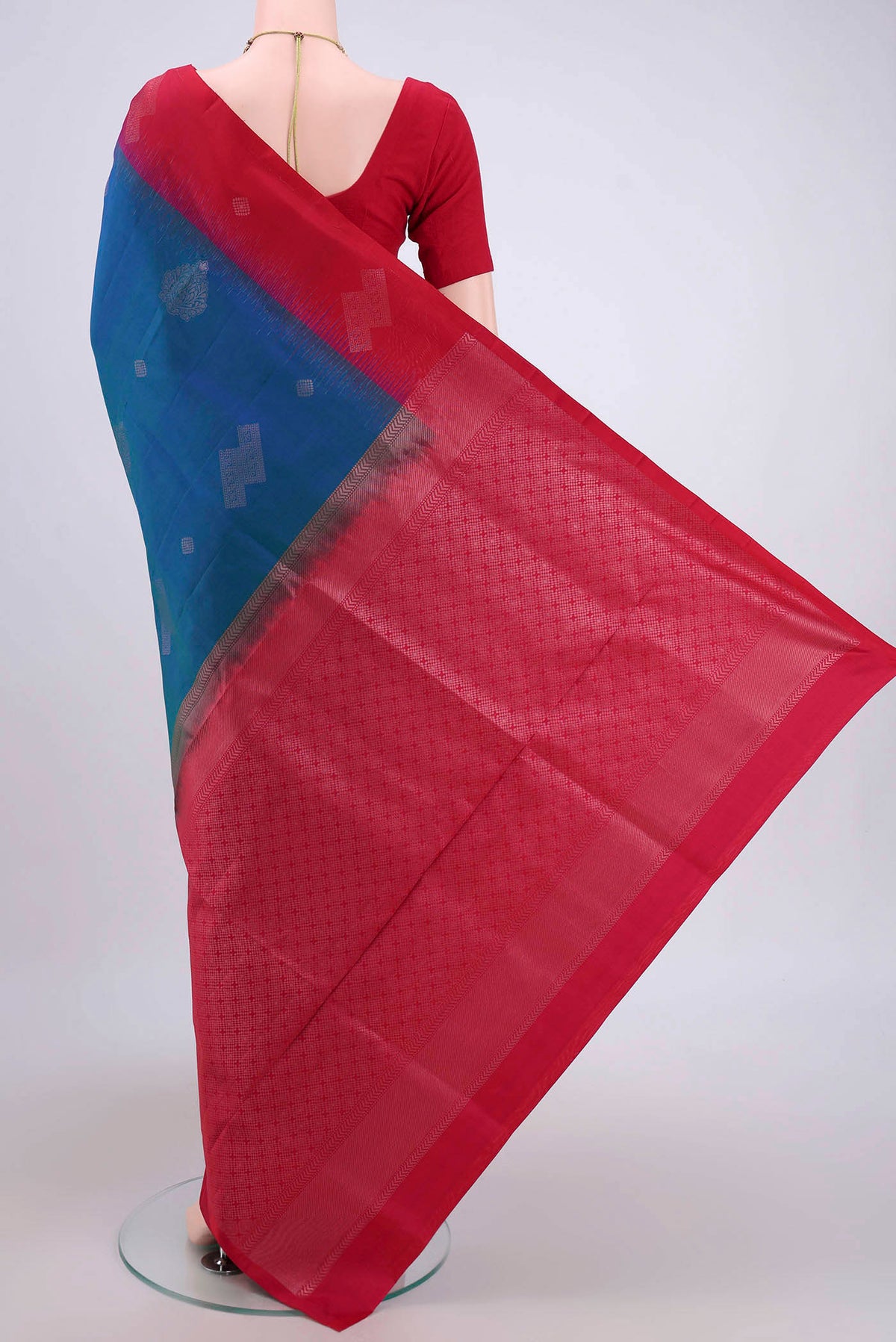 Flat view of Turquoise Soft Silk Saree with Zari Butta on the body and Zari Border. 