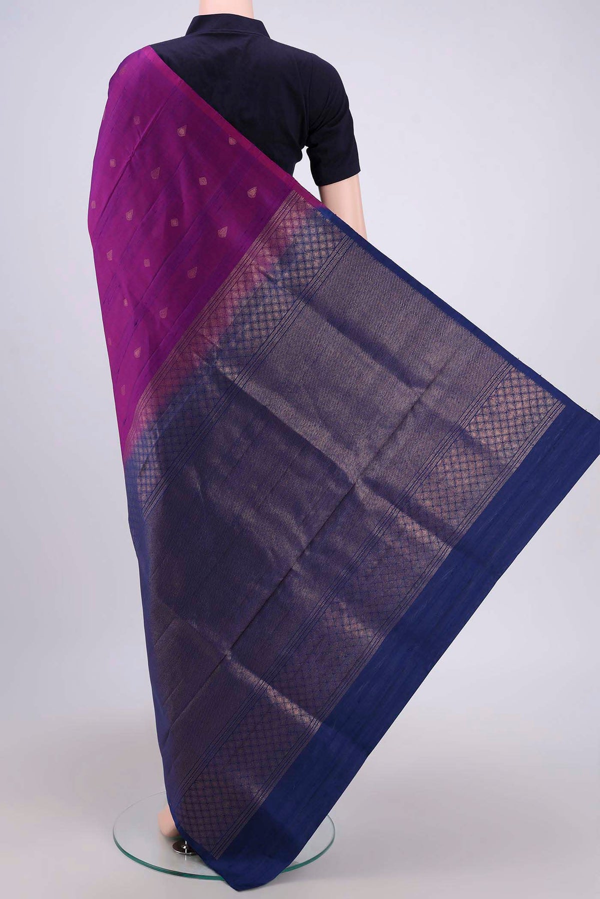 Flat view of Magenta Soft Silk Saree with Zari Butta on the body and Zari Border. 