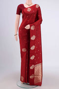 Maroon Banarasi Katan Silk Saree with Zari Butta on the body and Zari Border.  displayed on a mannequin