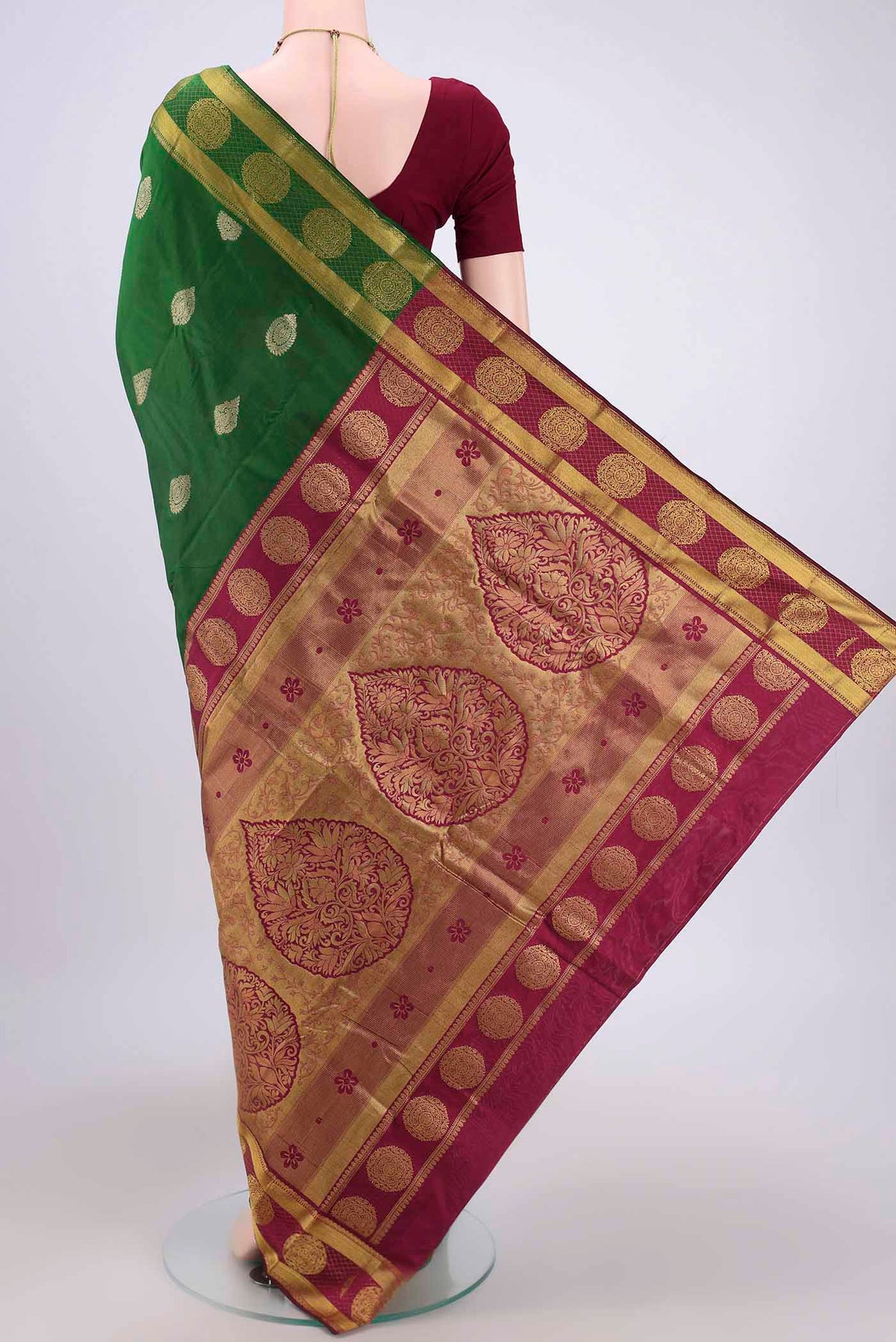 Flat view of Bottle Green Bangalore Silk Saree with Zari Butta on the body and Zari Border. 