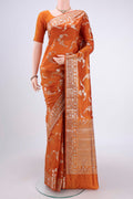 Rust Banarasi Raw Silk Saree with Zari Butta on the body and Zari Border.  displayed on a mannequin