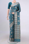 Blue Grey Banarasi Raw Silk Saree with Zari Butta on the body and Zari Border.  displayed on a mannequin