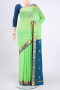Parrot Green Mysore Crepe Saree with Plain Body and Zari Border.  displayed on a mannequin