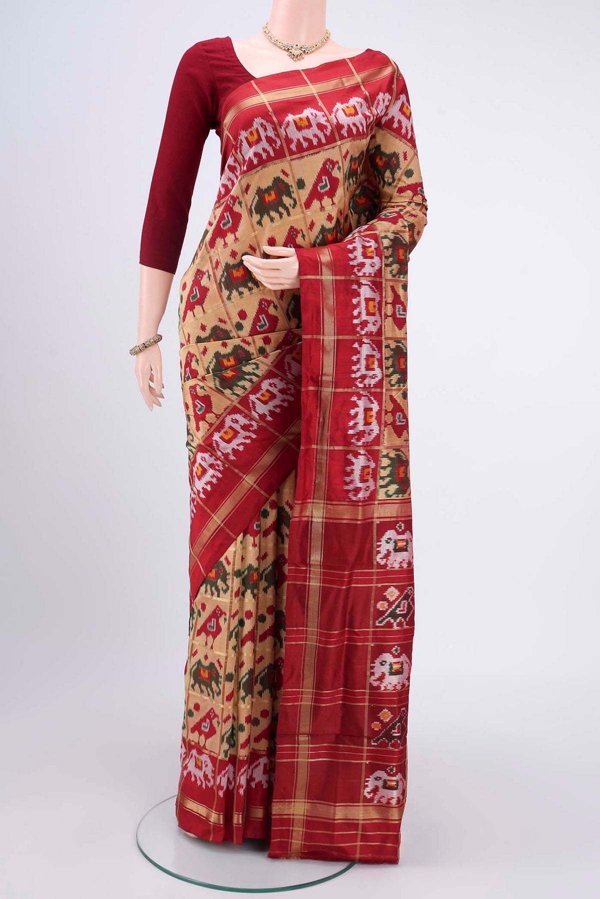 Dark Beige Pochampally Silk Saree with Checked design on the body and Zari Border.  displayed on a mannequin