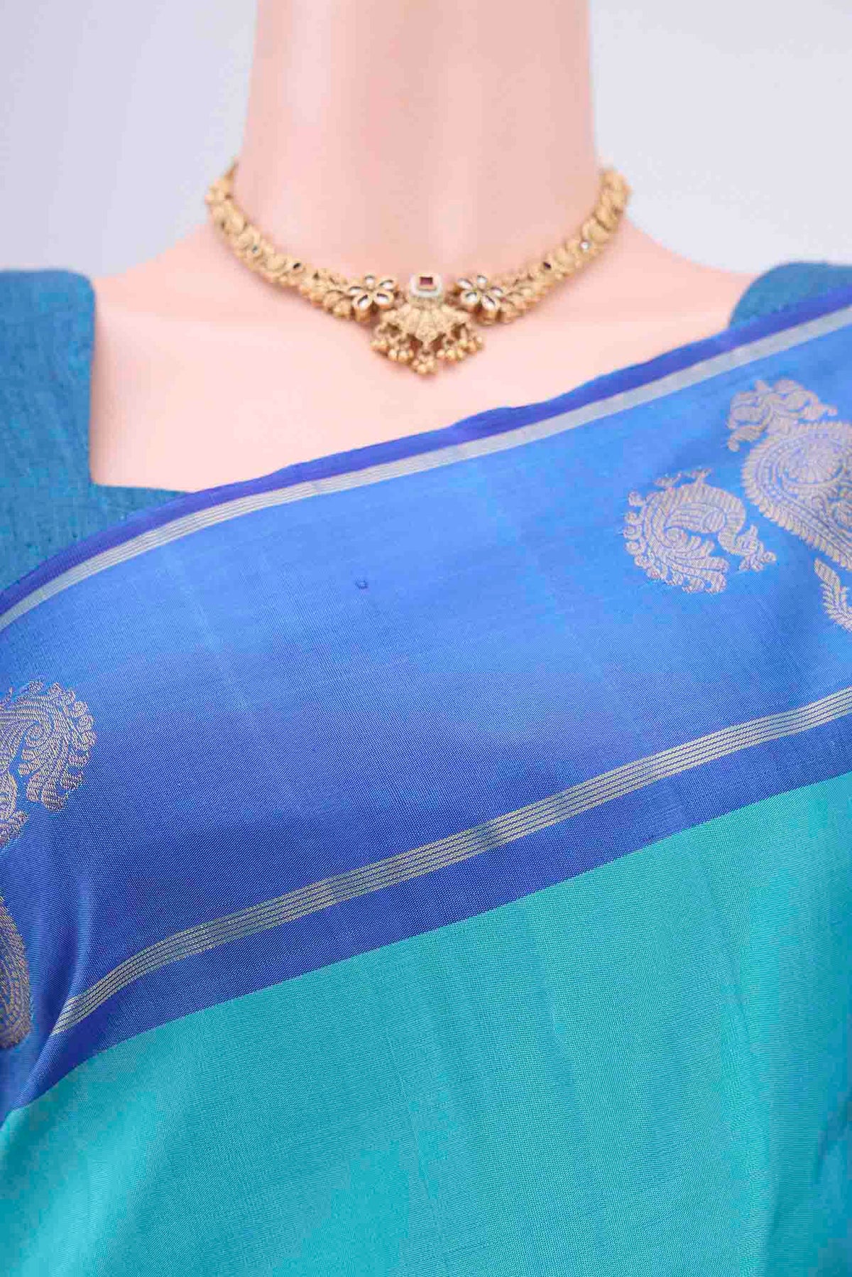 Border image of Turquoise Kanchipuram Silk Saree with Plain Body and Zari Border. 