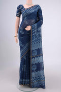 Indigo Maheshwari Silk Cotton Saree with Batik Print on the body and Zari Border.  displayed on a mannequin