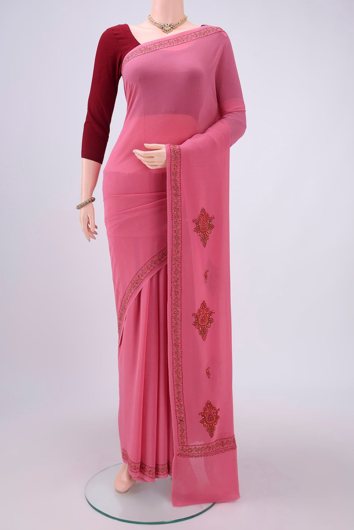Pink Kashmiri Saree with Plain Body and Thread Border.  displayed on a mannequin