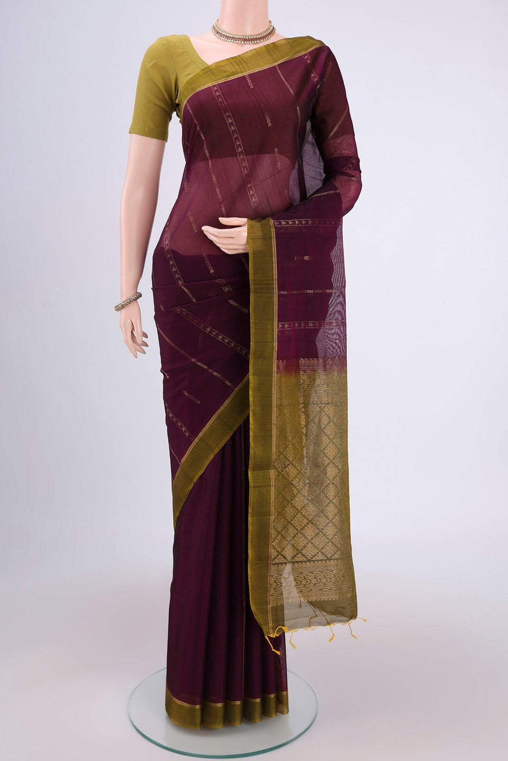Magenta Silk Cotton Saree with Zari Butta on the body and Zari Border.  displayed on a mannequin