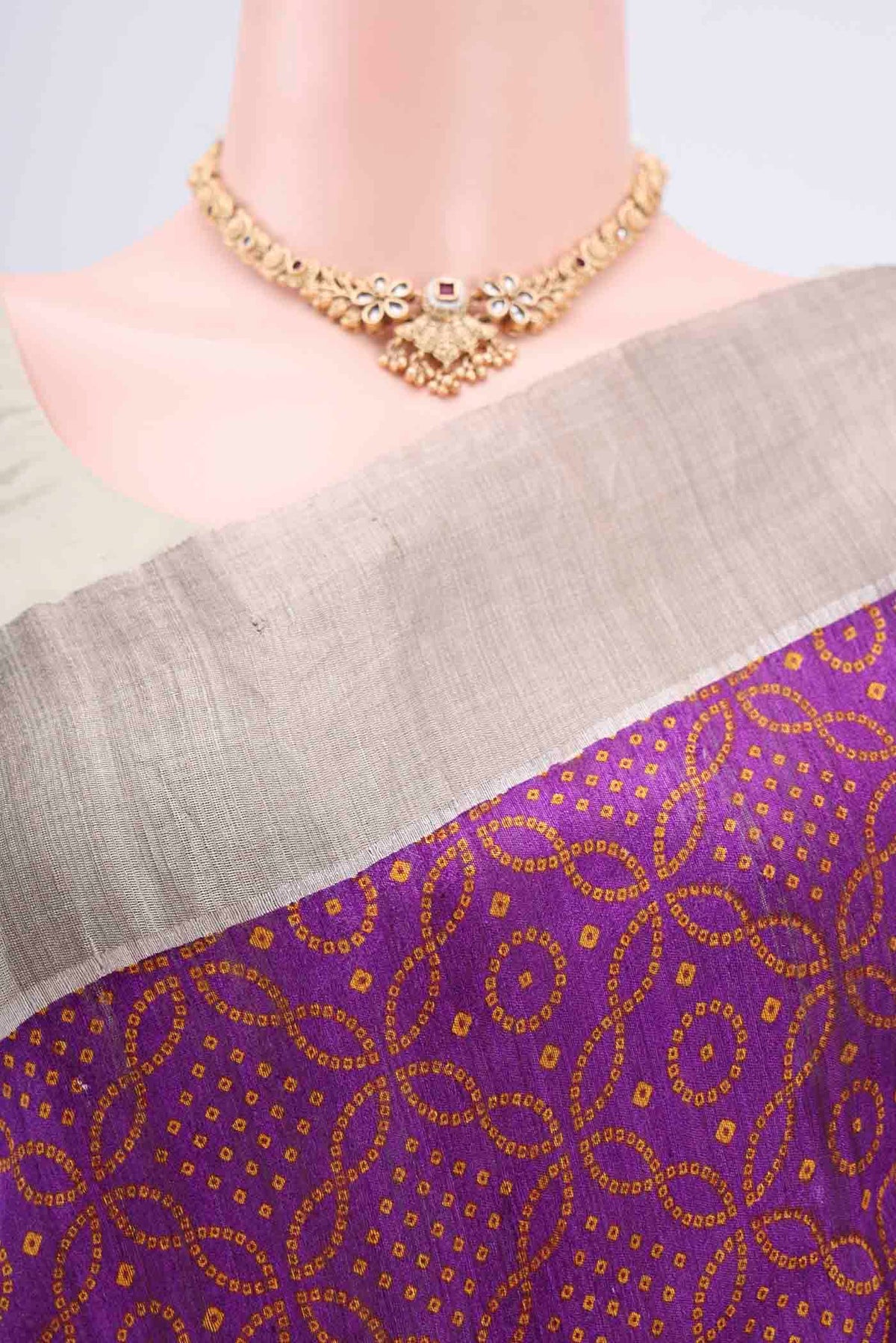 Border image of Purple Tussar Silk Saree with Bandhani Print on the body and Zari Border. 