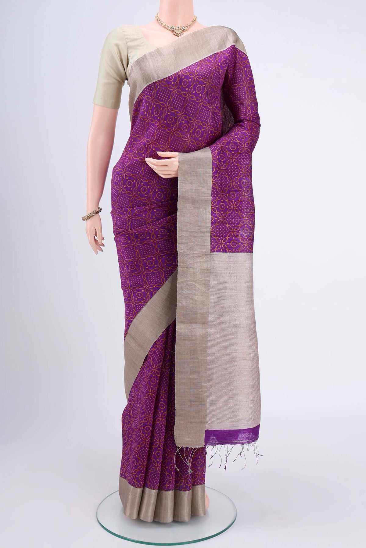 Purple Tussar Silk Saree with Bandhani Print on the body and Zari Border.  displayed on a mannequin