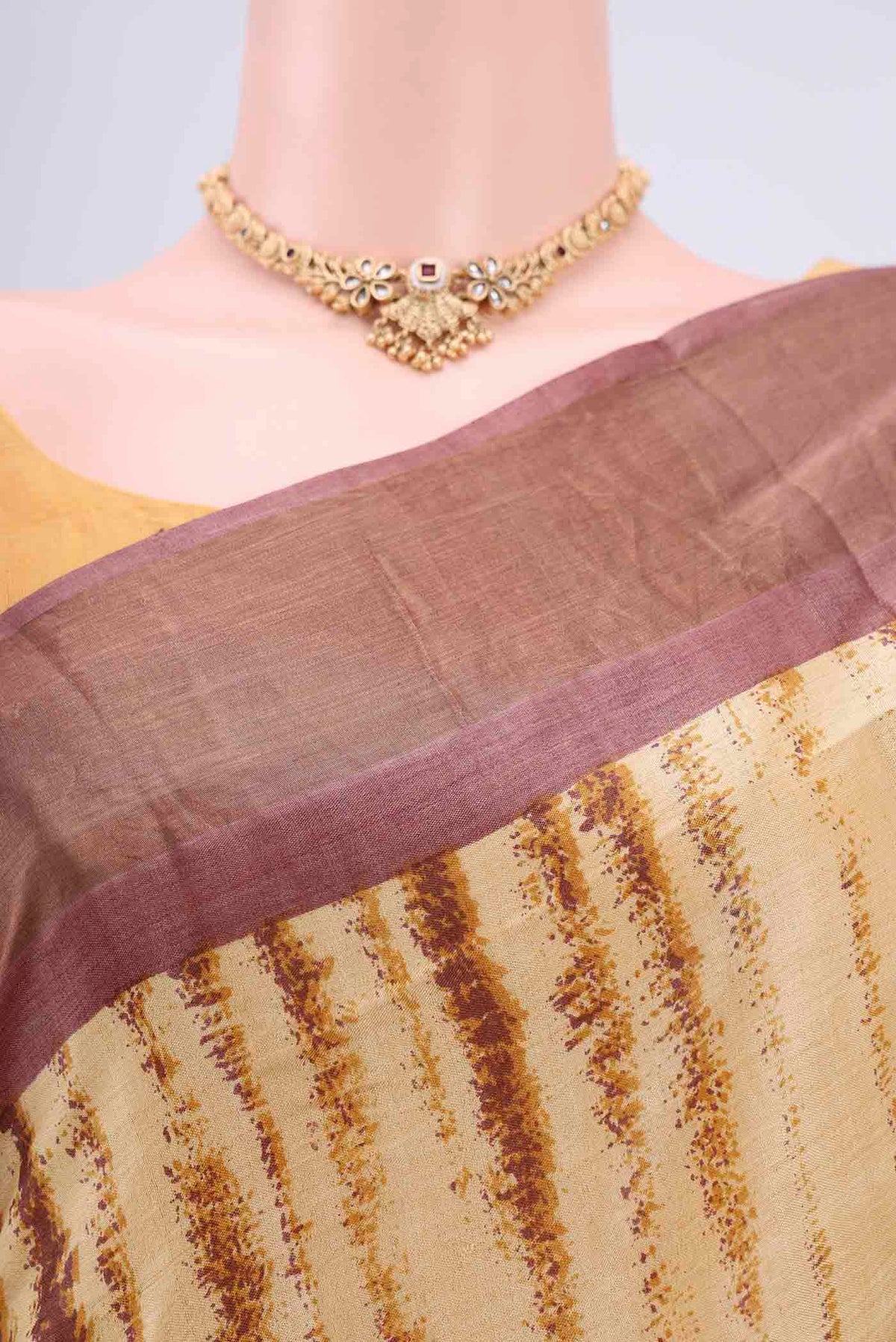 Border image of Cream Tussar Silk Saree with Printed design on the body and Zari Border. 