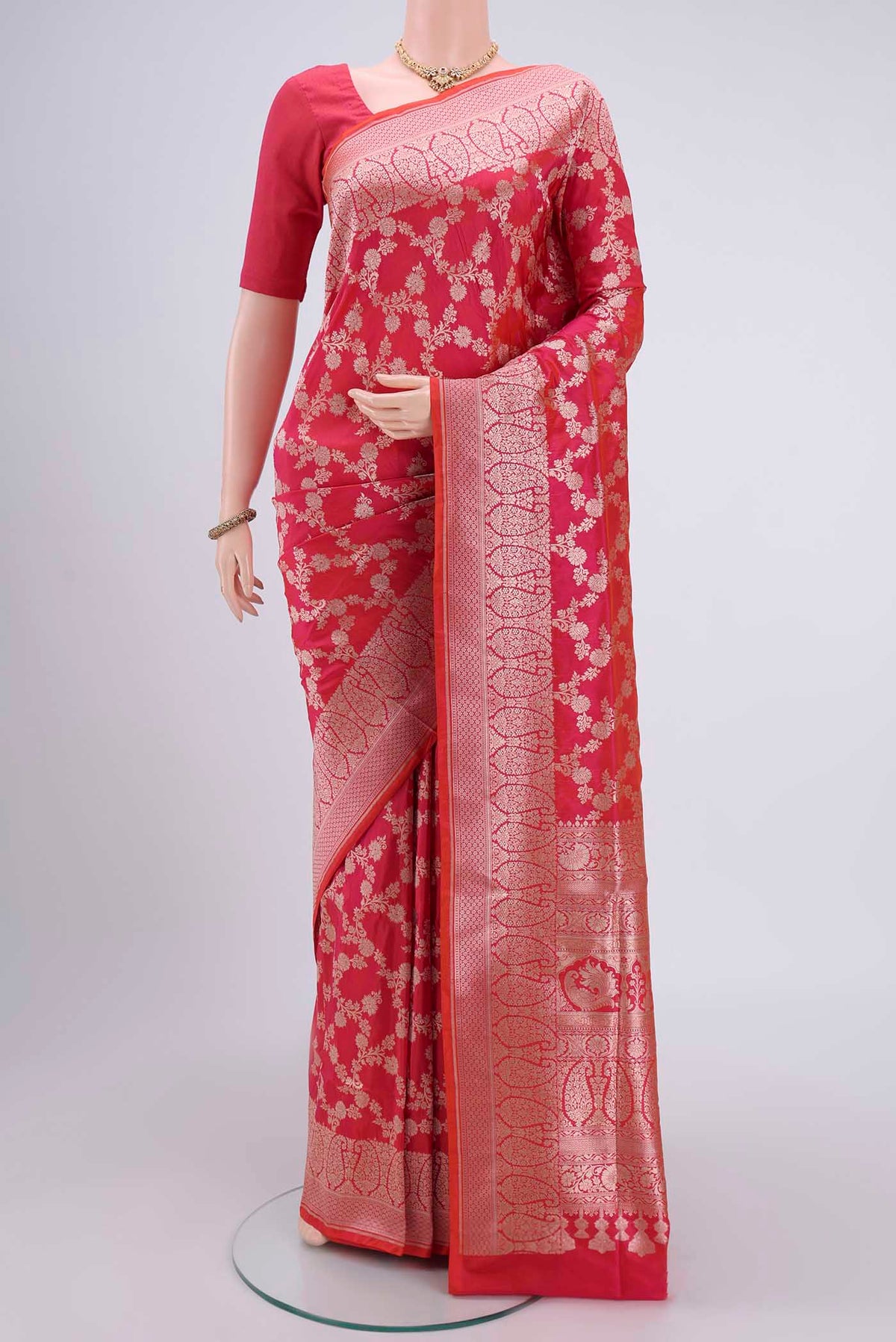 Pink Bangalore Silk Saree with Zari Butta on the body and Zari Border.  displayed on a mannequin