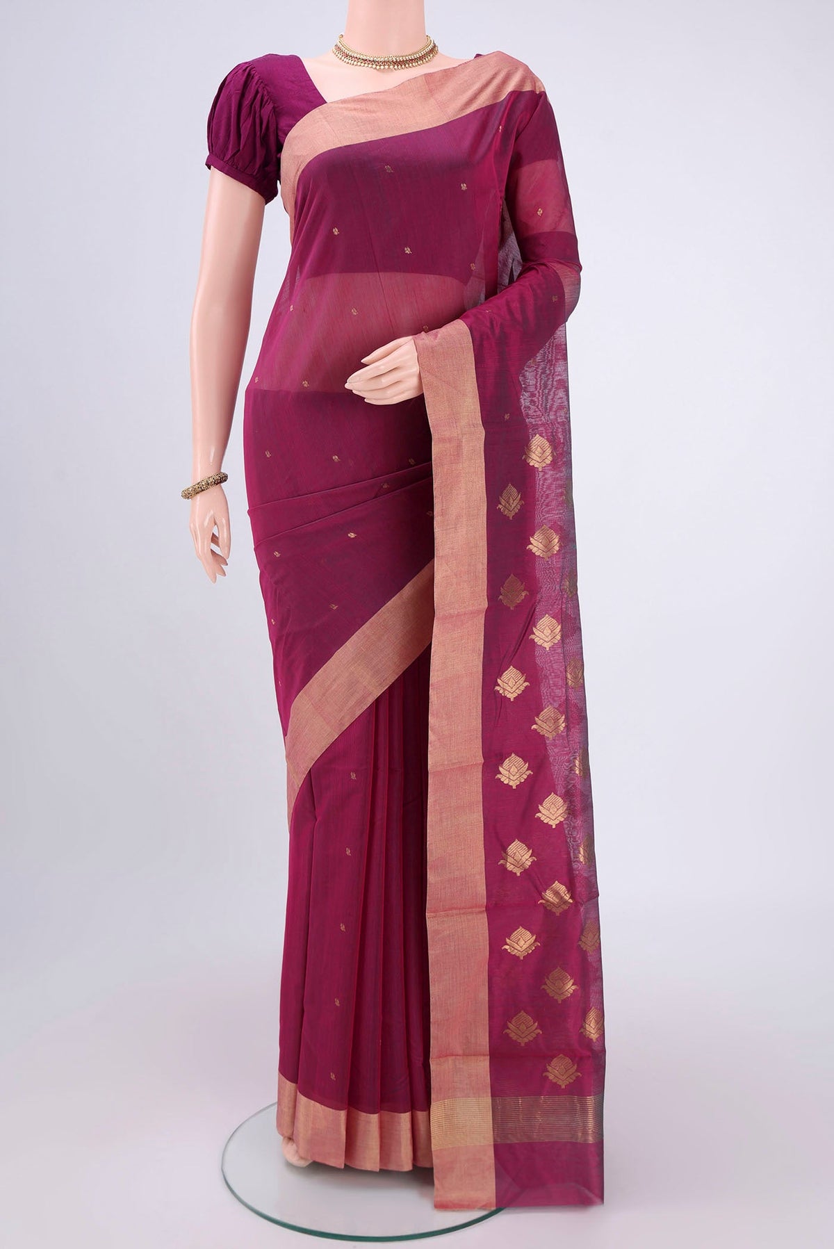 Magenta Chanderi Silk Cotton Saree with Zari Butta on the body and Zari Border.  displayed on a mannequin