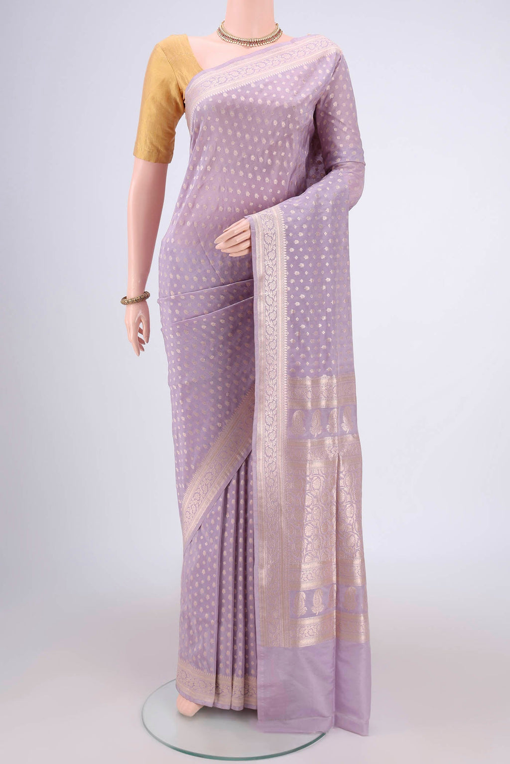 Lavender Dual Tone Banarasi Silk Saree with Zari Butta on the body and Zari Border.  displayed on a mannequin