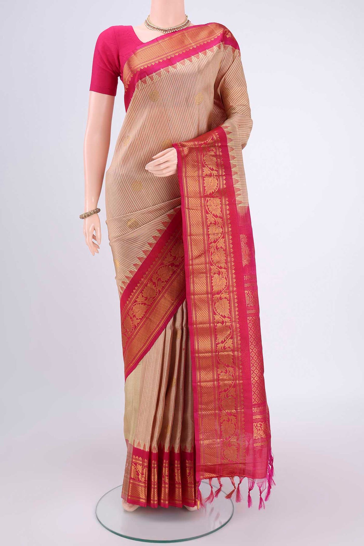 Beige Gadwal Silk Saree with Checked design on the body and Zari Border.  displayed on a mannequin