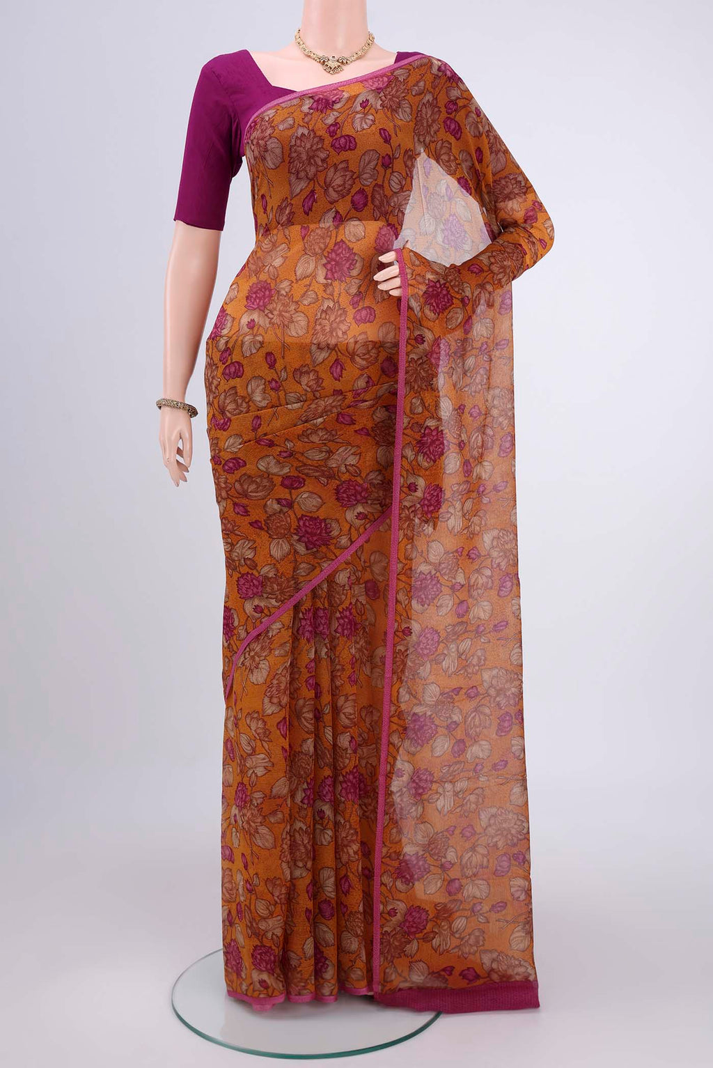Mustard Mysore Chiffon Saree with Floral Print on the body and Without Border.  displayed on a mannequin