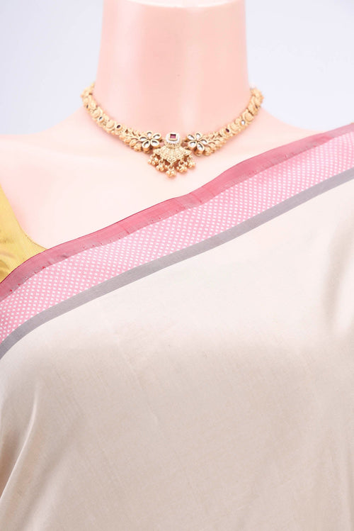 Border image of Beige Banarasi Silk Saree with Plain Body and Zari And Thread Border. 