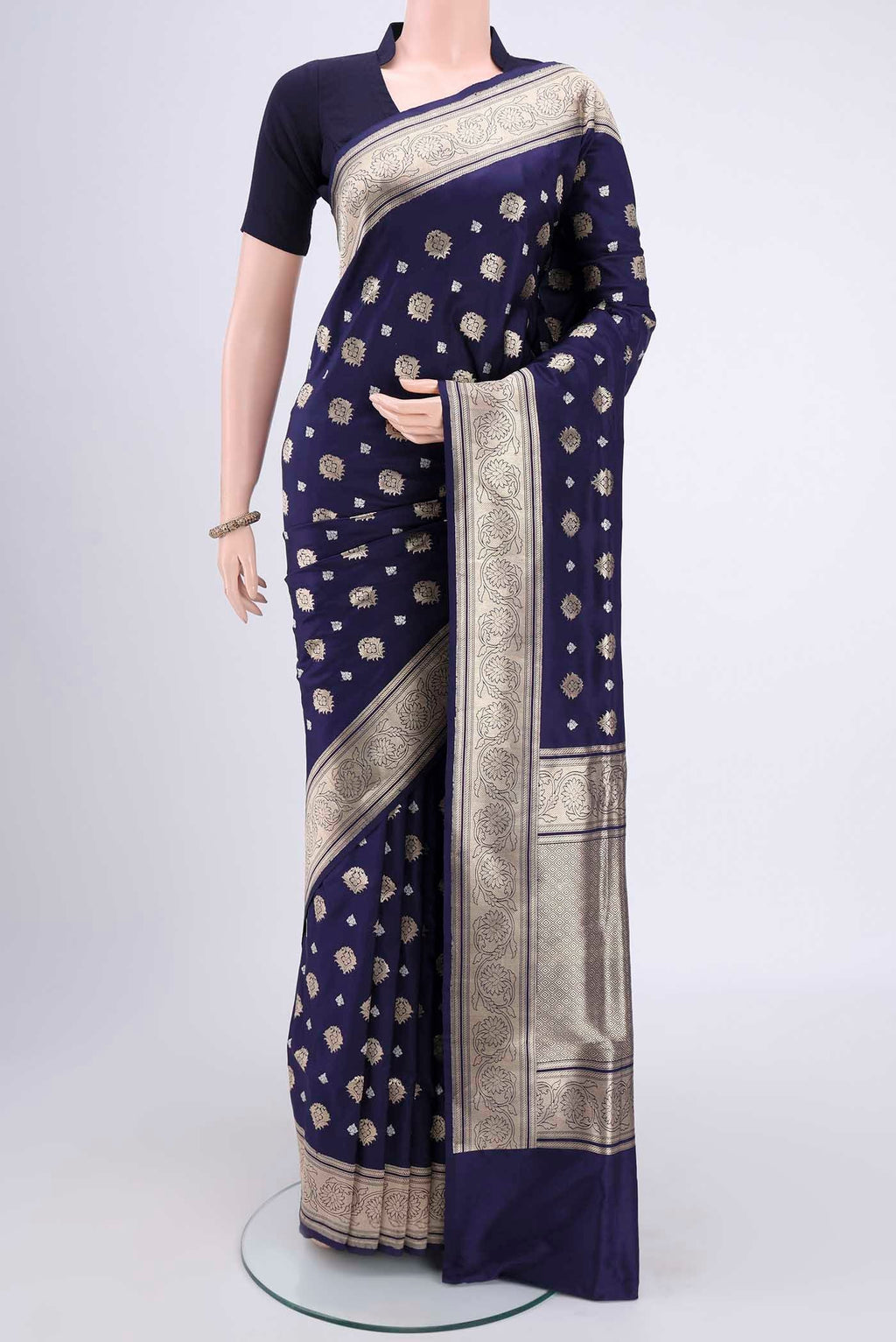 Navy Blue Banarasi Silk Saree with Zari Butta on the body and Zari Border.  displayed on a mannequin