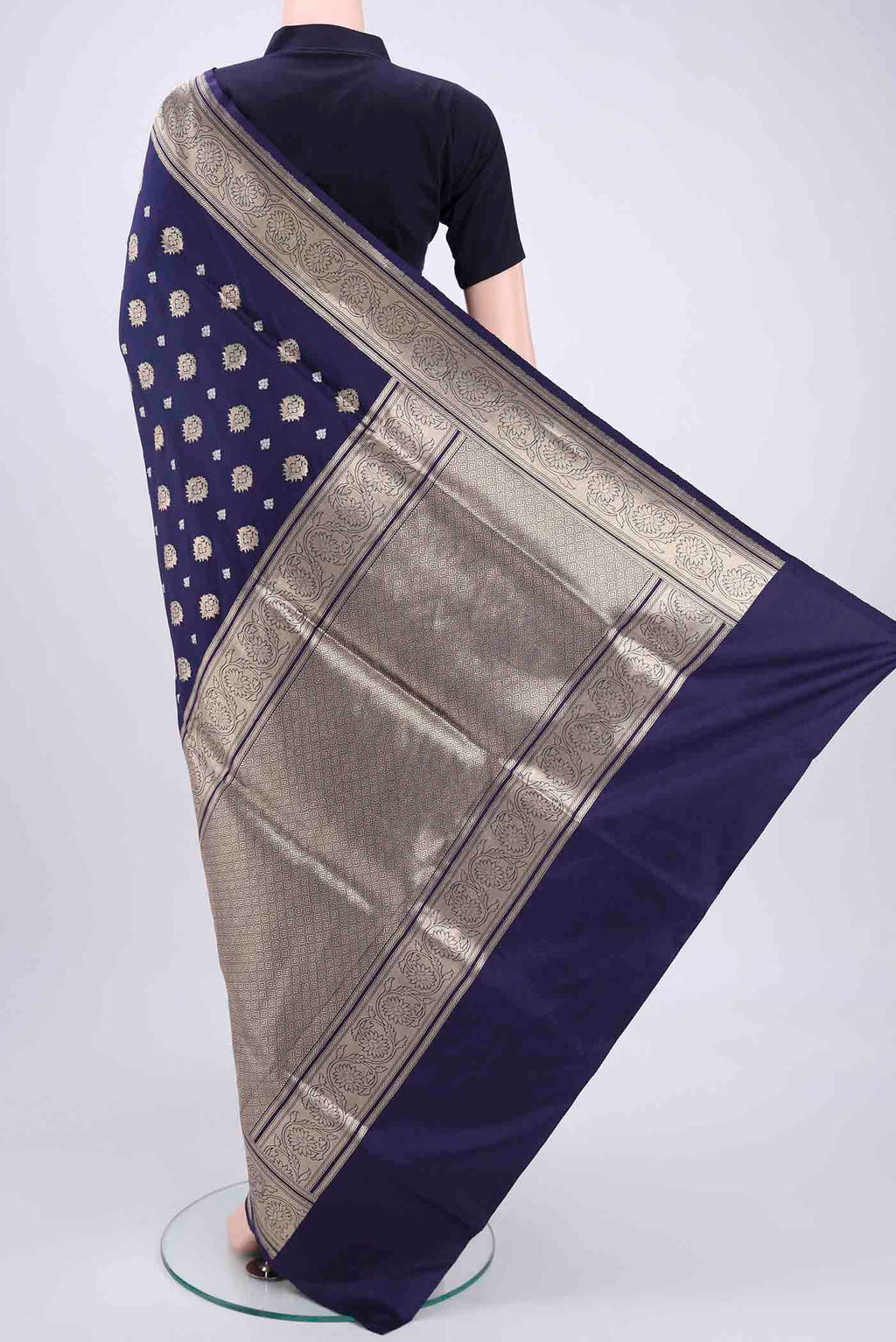 Flat view of Navy Blue Banarasi Silk Saree with Zari Butta on the body and Zari Border. 