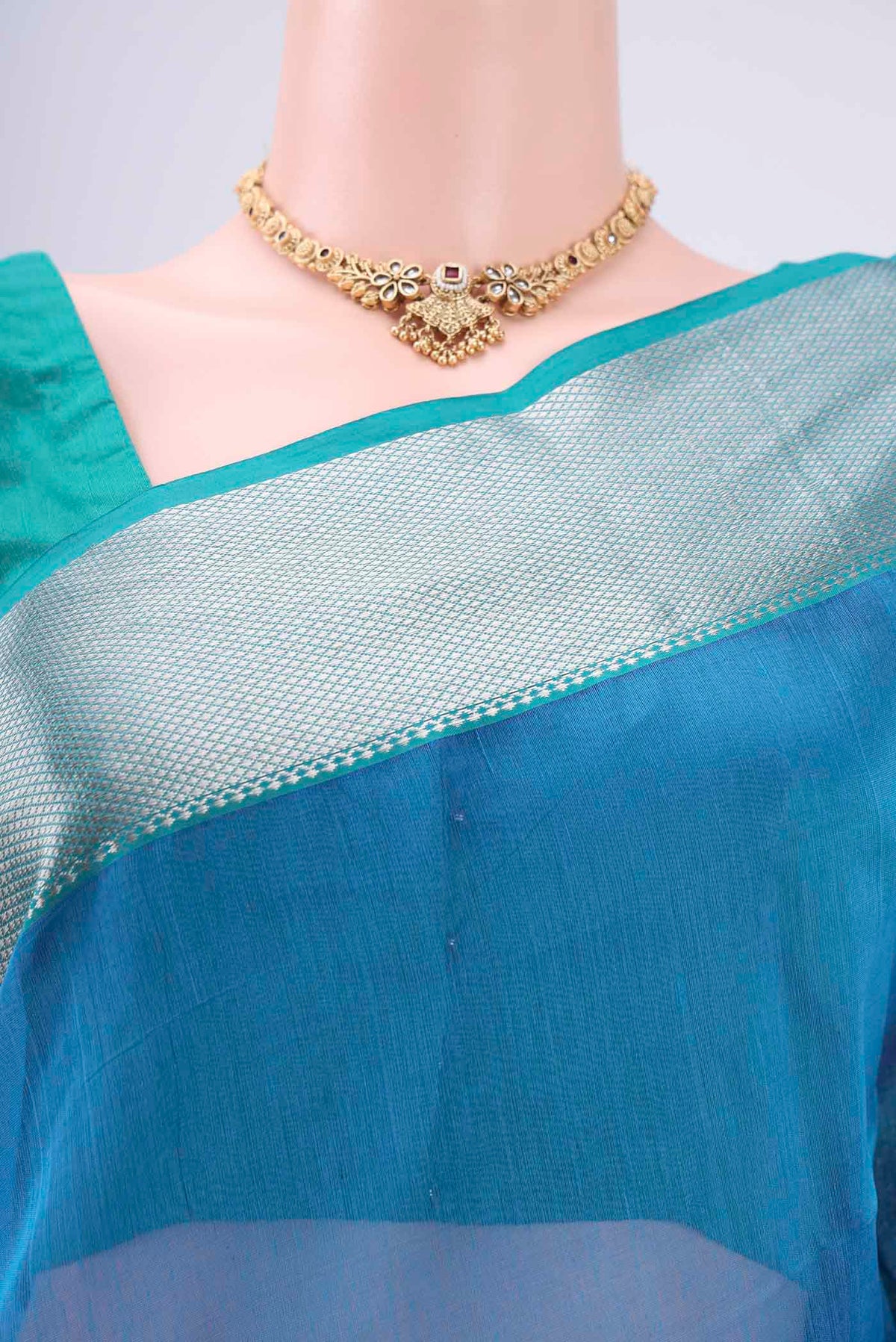 Border image of Turquoise Maheshwari Silk Cotton Saree with Plain Body and Zari Border. 
