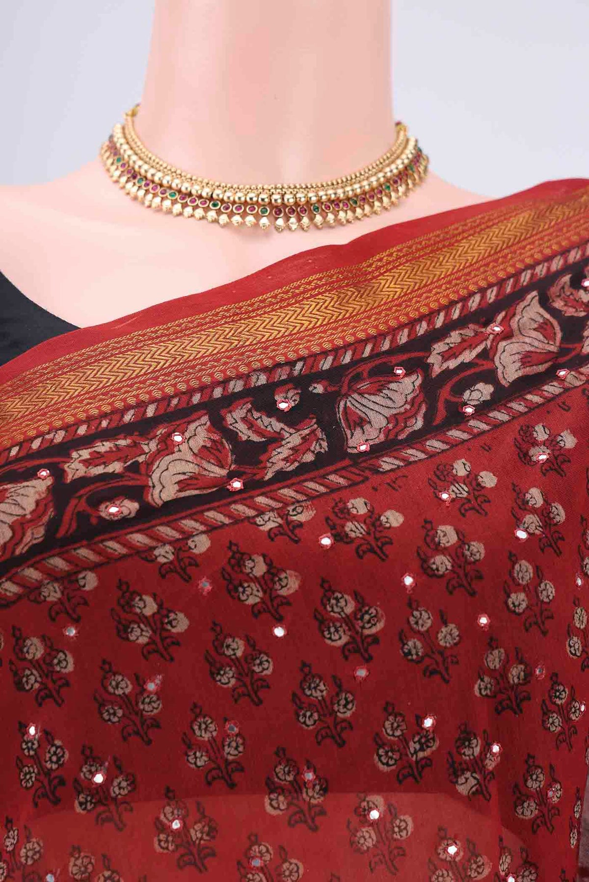 Border image of Rust Maheshwari Silk Cotton Saree with Printed design on the body and Zari Border. 