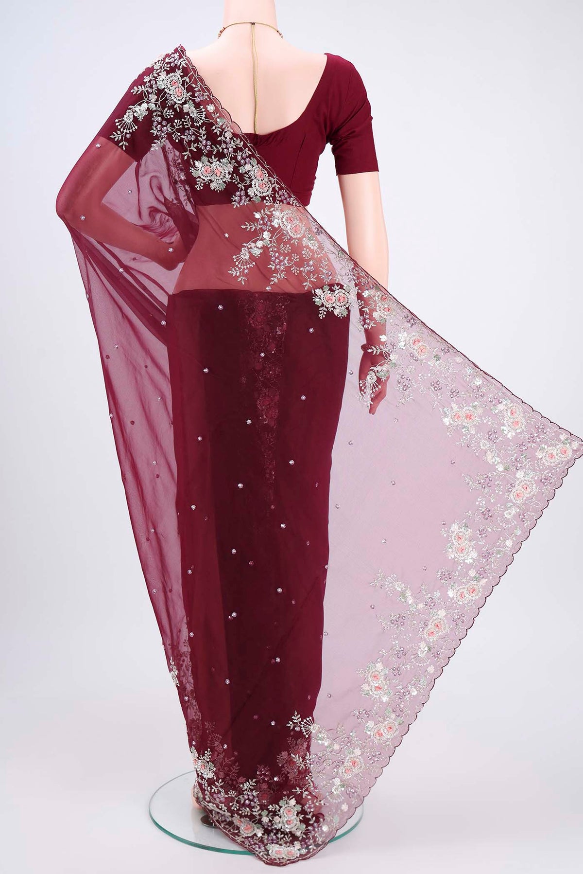 Flat view of Maroon Organza Silk Saree with Embroidery on the body and Embroidery Border. 