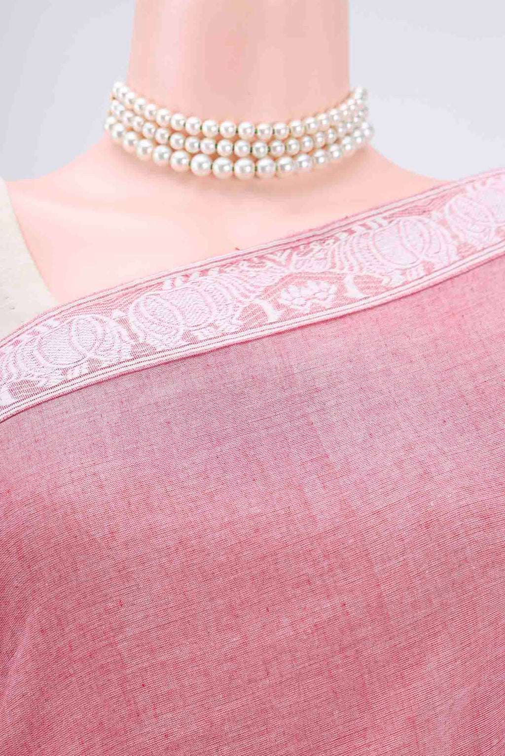 Border image of Pink Assam Cotton Saree with Thread Butta on the body and Plain Border. 
