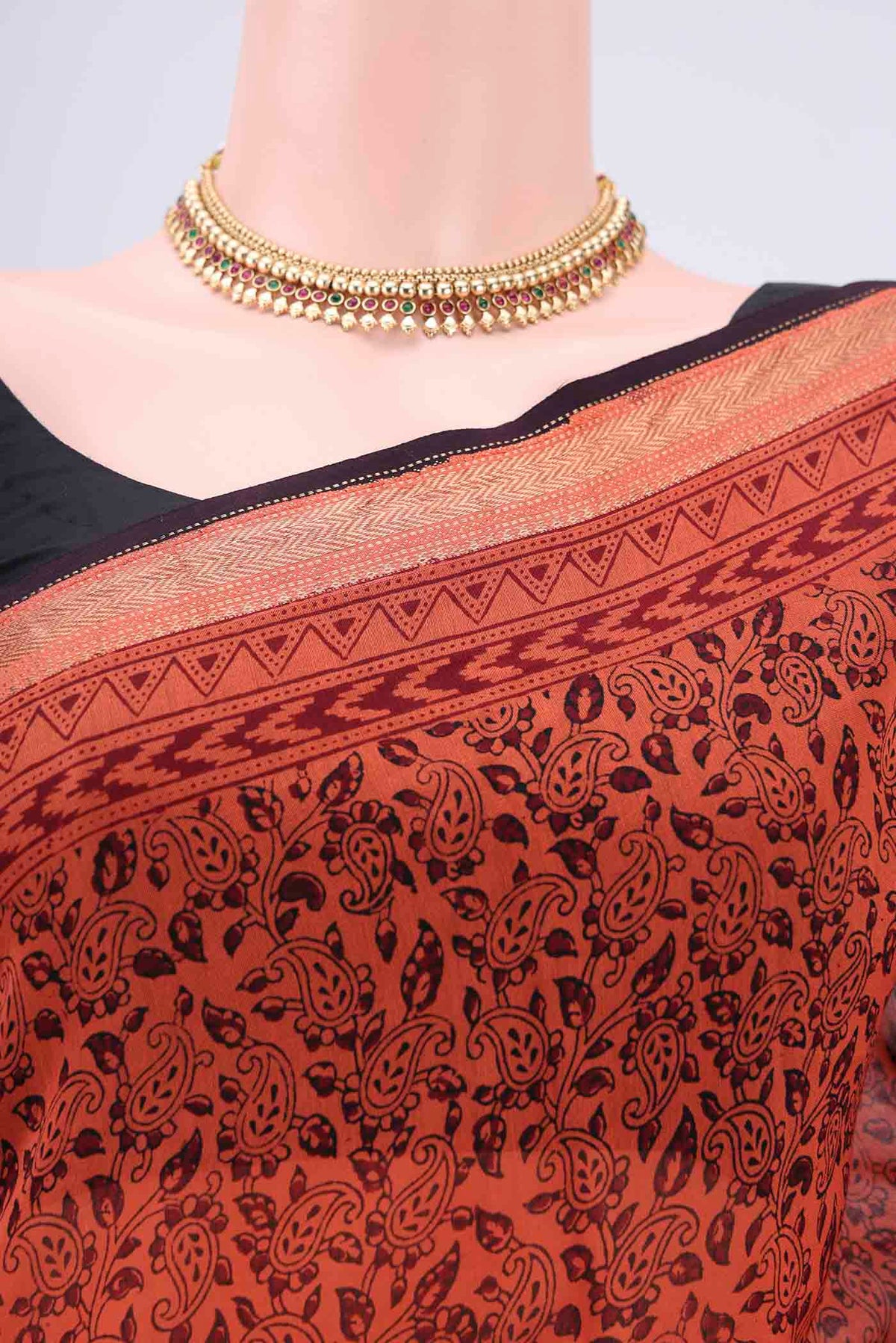 Border image of Orange Maheshwari Silk Cotton Saree with Printed design on the body and Zari Border. 