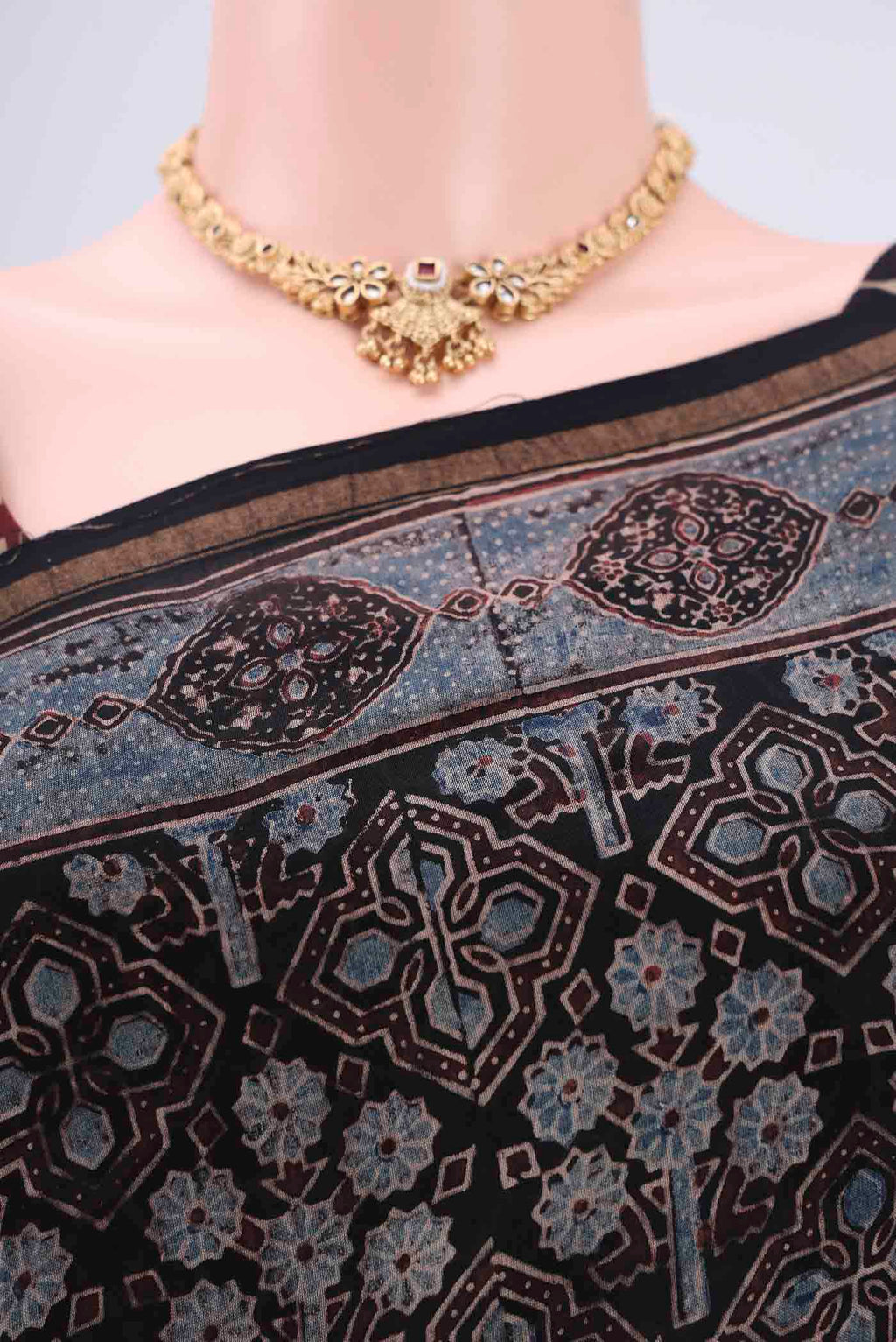 Border image of Black Chanderi Silk Cotton Saree with Ajrakh Print on the body and Zari Border. 