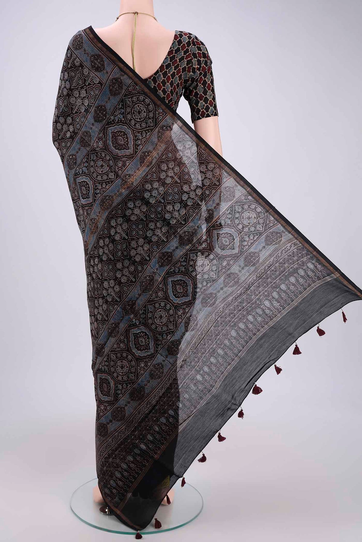 Flat view of Black Chanderi Silk Cotton Saree with Ajrakh Print on the body and Zari Border. 