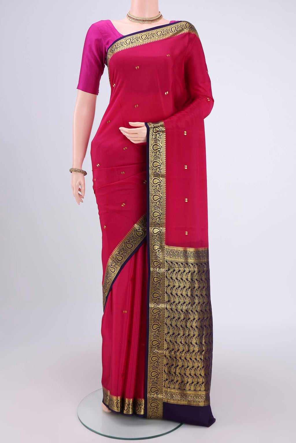 Rani Pink Mysore Crepe Saree with Plain Body and Zari Border.  displayed on a mannequin