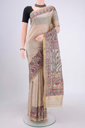 Beige Tussar Silk Saree with Printed design on the body and Zari Border.  displayed on a mannequin