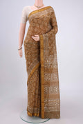 Mustard Maheshwari Silk Cotton Saree with Batik Print on the body and Zari Border.  displayed on a mannequin