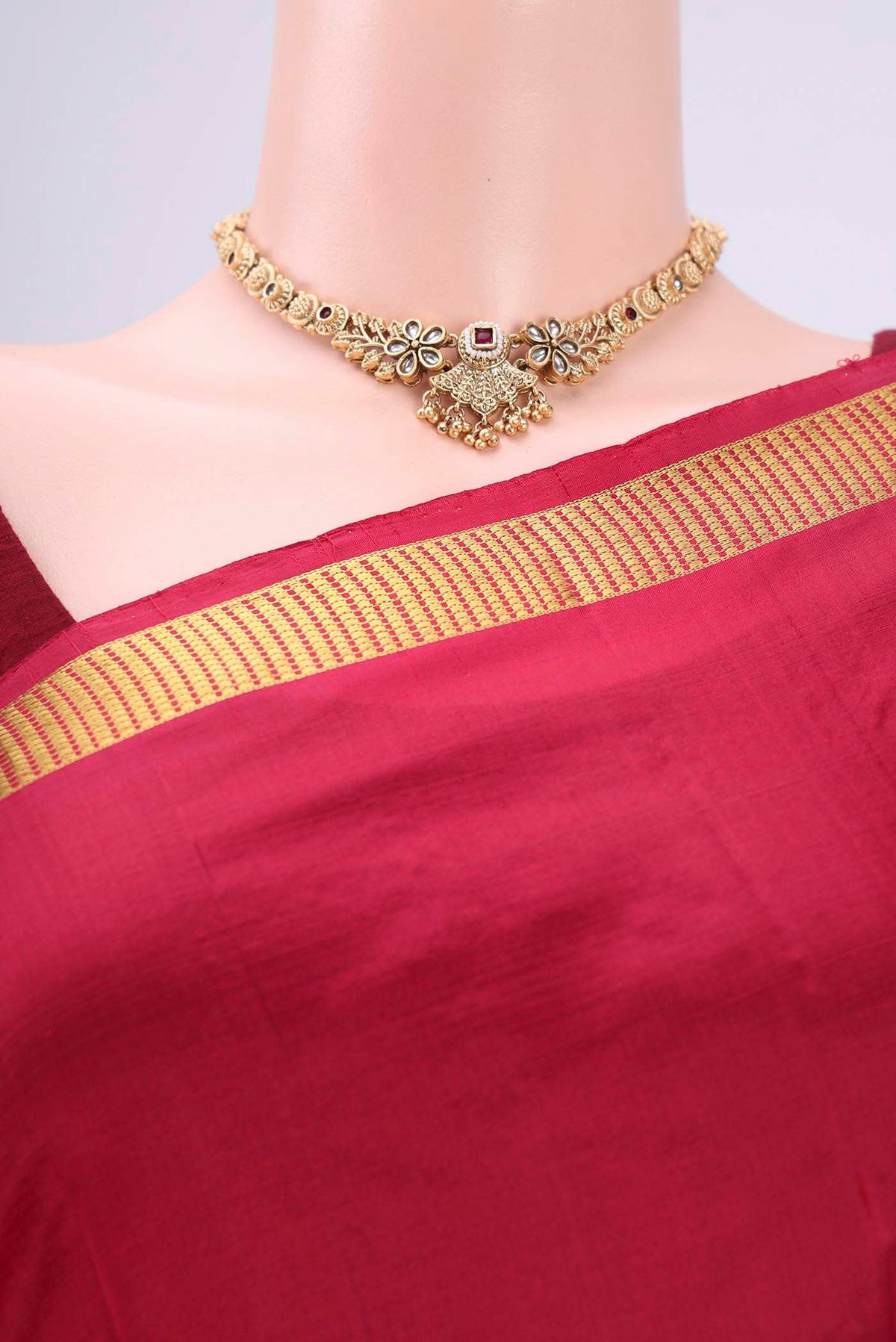 Border image of Maroon Kanchipuram Silk Saree with Plain Body and Zari Border. 