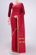 Maroon Kanchipuram Silk Saree with Plain Body and Zari Border.  displayed on a mannequin
