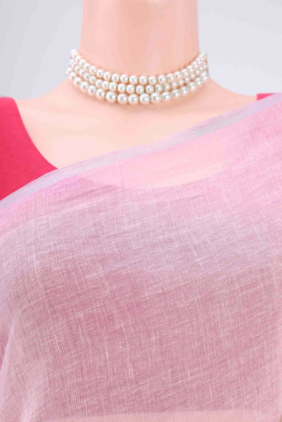 Border image of Pink Linen Saree with Floral Print on the body and Zari Border. 