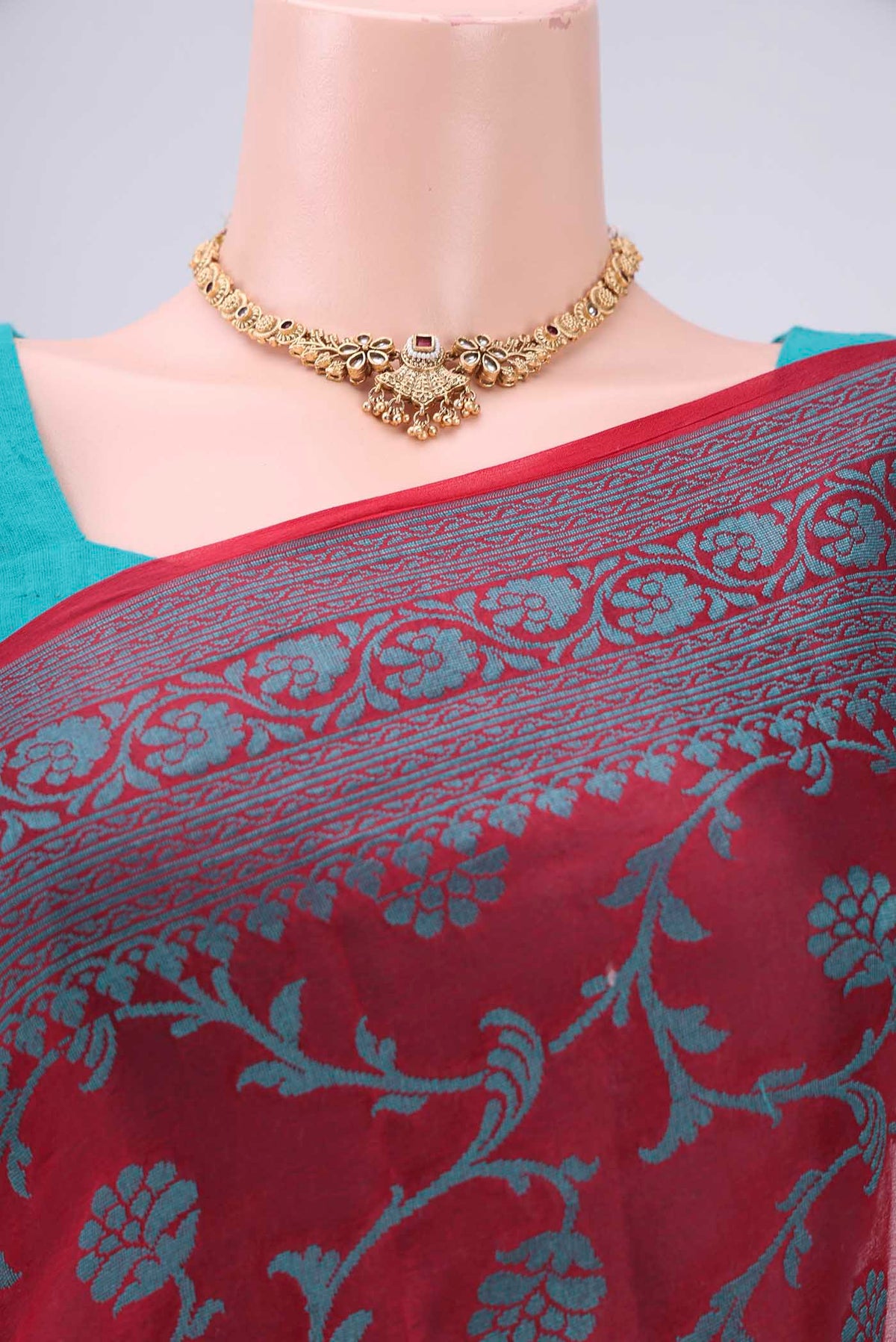 Border image of Red Blended Banarasi Georgette Saree with Thread Brocade on the body and Zari Border. 