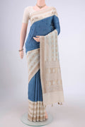 Blue MP Tussar Saree with Embroidery on the body and Zari Border.  displayed on a mannequin
