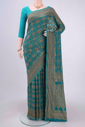 Sea Green Banarasi Georgette Saree with Zari Brocade on the body and Zari Border.  displayed on a mannequin