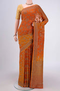 Rust Banarasi Georgette Saree with Zari Brocade on the body and Zari Border.  displayed on a mannequin