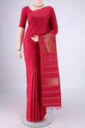 Pure Silk Pure Zari Maroon Kanjivaram Saree with Zari Butta on the body and Without Border.  displayed on a mannequin