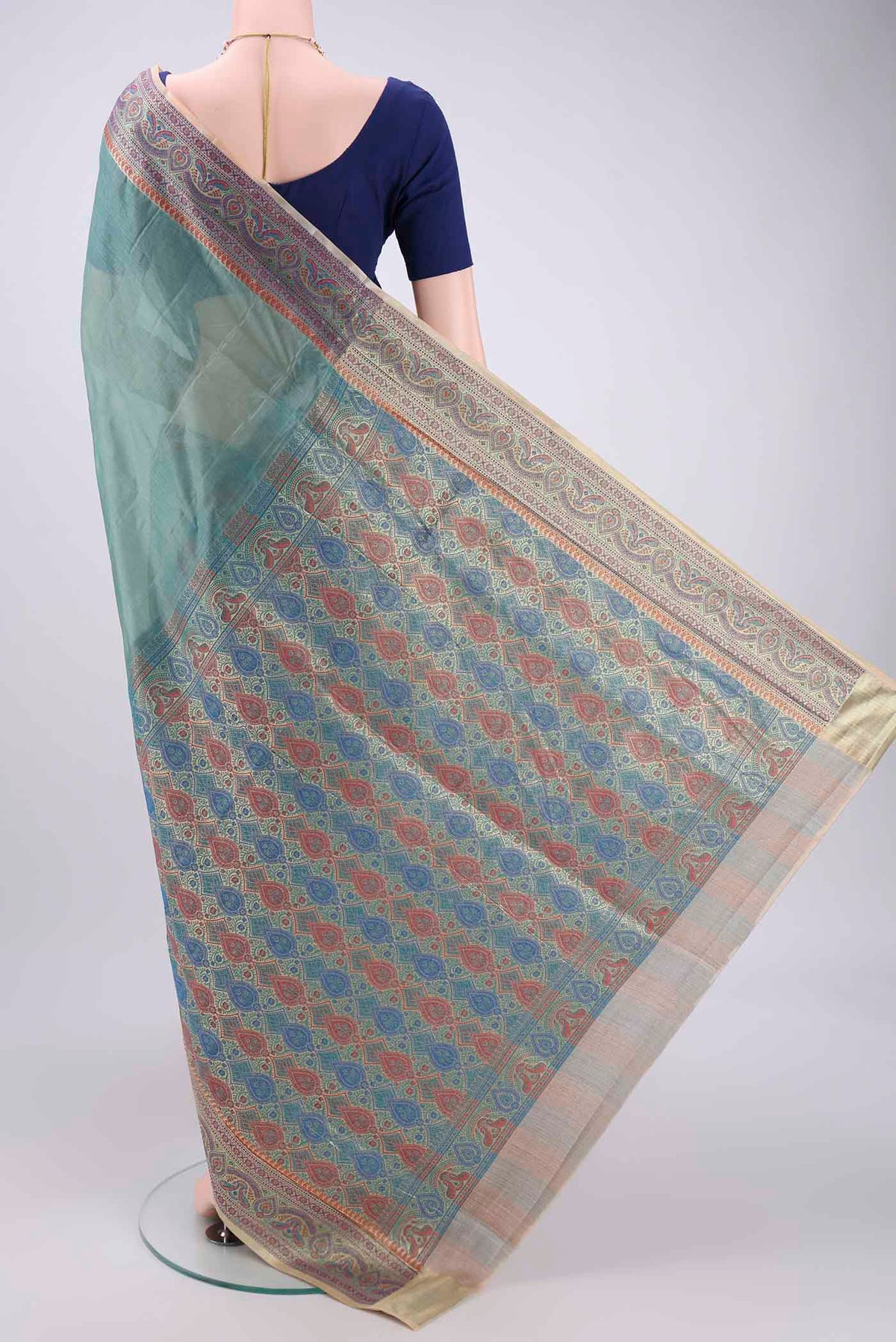 Flat view of Sea Green Banarasi Tussar Silk Saree with Zari Butta on the body and Zari And Thread Border. 