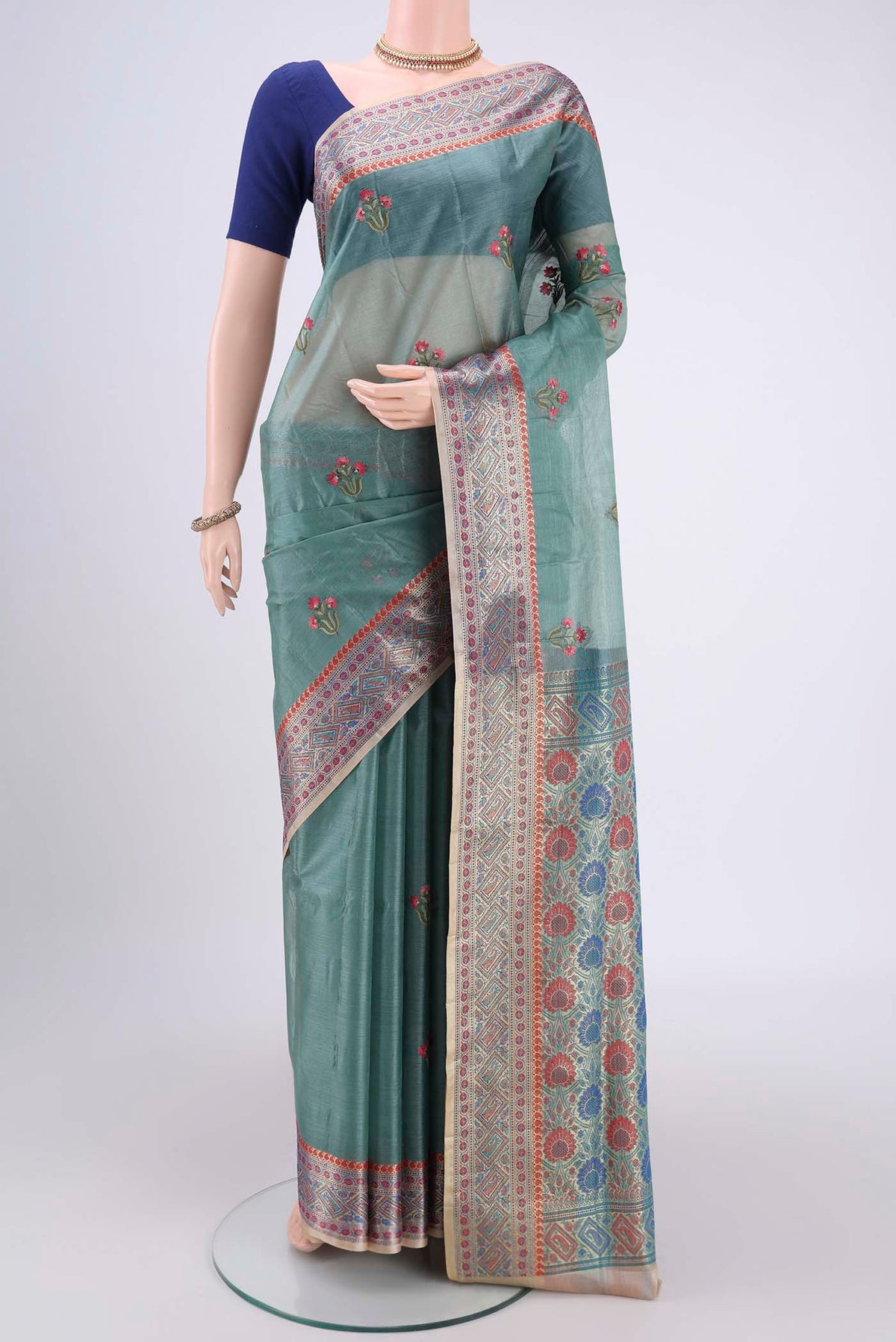 Sea Green Banarasi Tussar Silk Saree with Zari Butta on the body and Zari And Thread Border.  displayed on a mannequin