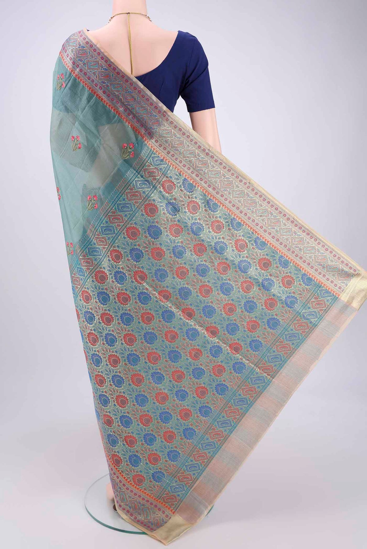 Flat view of Sea Green Banarasi Tussar Silk Saree with Zari Butta on the body and Zari And Thread Border. 