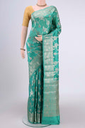 Sea Green Banarasi Raw Silk Saree with Zari Butta on the body and Zari Border.  displayed on a mannequin